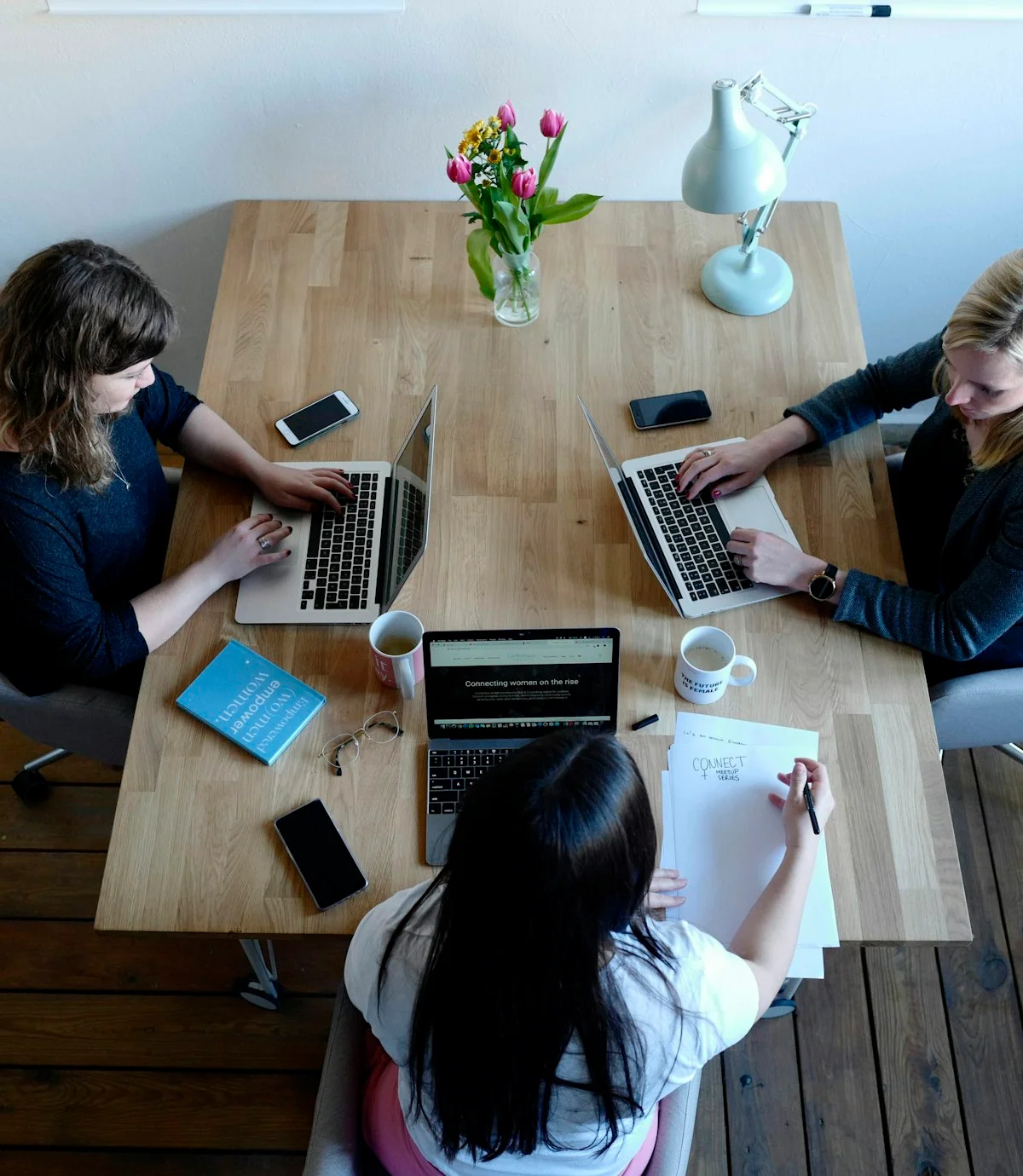 A manager and their team in a delivery review meeting