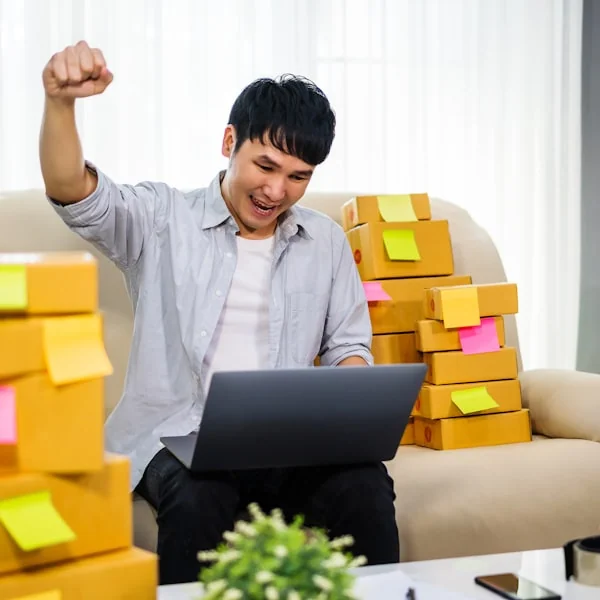Portrait of a team member unboxing a new laptop