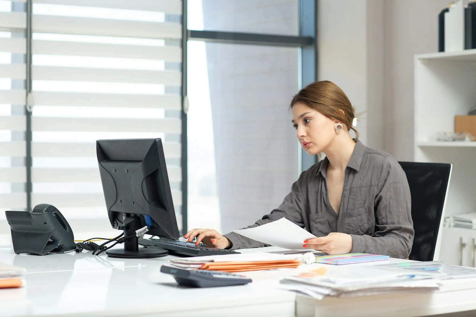 Finance professionals reviewing reports together in warm natural light