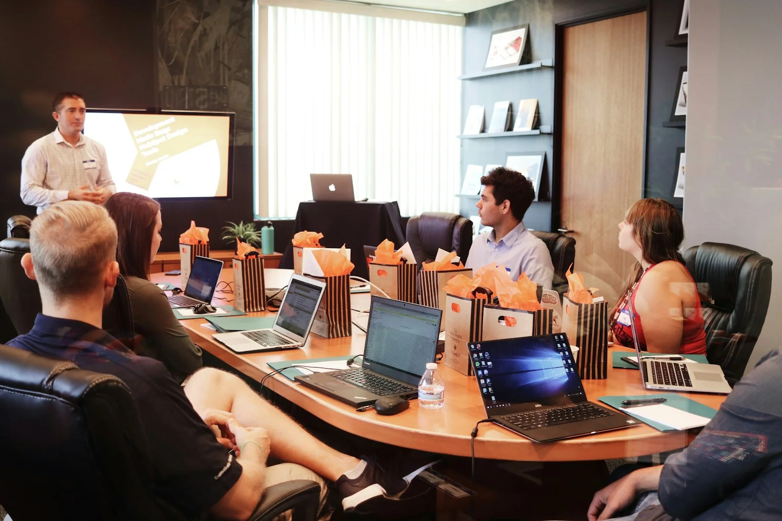 Operations team reviewing workflows together in warm natural light